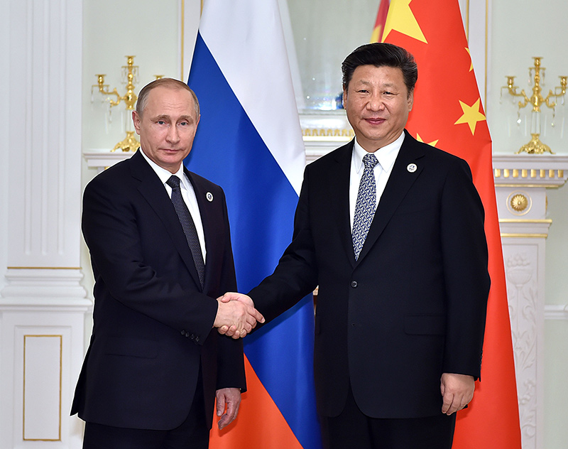 6月23日，國(guó)家主席習(xí)近平在烏茲別克斯坦塔什干會(huì)見俄羅斯總統(tǒng)普京。新華社記者李濤攝