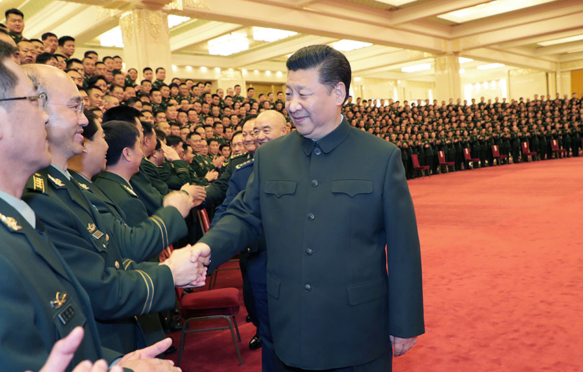 2018年2月2日，中共中央總書記、國家主席、中央軍委主席習(xí)近平在北京接見武警部隊(duì)第三次黨代表大會(huì)全體代表。這是習(xí)近平同代表們親切握手。新華社記者 李剛 攝